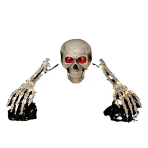 Glowing Halloween skull and skeleton hands garden stake decorations with LED lights