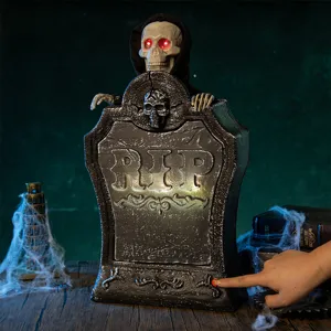 Lápida de Halloween terrorífica con calavera de ojos rojos brillantes y sonido