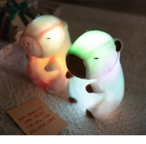 Cute glowing capybara plush night light detail view, soft LED colorful glowing toy for kids room.
