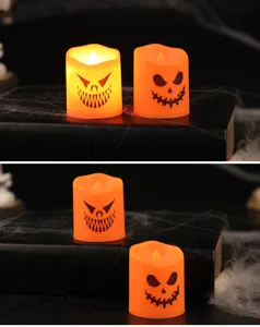 Halloween LED candles with spooky ghost faces glowing on a dark decorative setting.