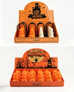 Detail of Halloween pumpkin and skull LED candle lamps in display boxes
