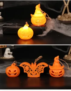 Detail view of Halloween LED pumpkin and bat ornaments featuring a warm orange glowing effect