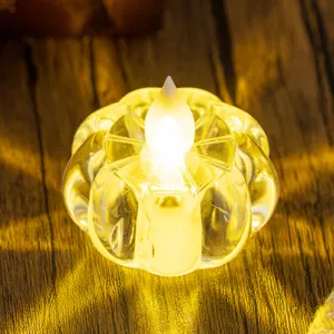 Pumpkin-shaped glass tea light holder with warm LED candle light for mood lighting