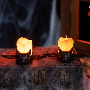 Spooky Halloween LED bat candle lights with warm yellow glow for haunted house tabletop decor