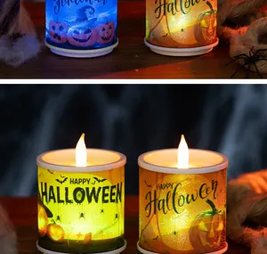 Close-up of glowing Halloween LED candles with pumpkin, bats and spider patterns