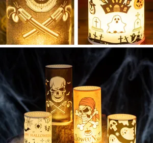 Close-up detail of Halloween LED candles featuring various spooky patterns and warm glow