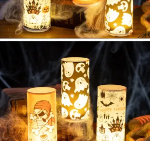 Halloween LED candles with ghost, skull and haunted house patterns in a spooky scene