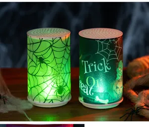 Atmospheric Halloween LED candles with spooky spider web and Trick or Treat graphic