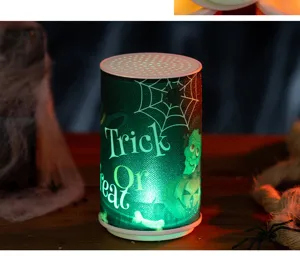 Green glowing Halloween electronic candle with Trick or Treat design and Frankenstein motif