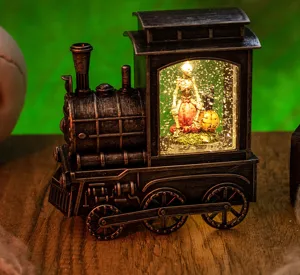 Close-up of Halloween locomotive water lantern with skeleton and pumpkin interior