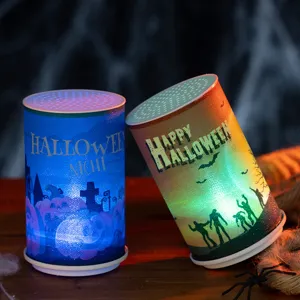 Atmospheric Halloween electronic candles with pumpkin and zombie silhouette patterns.