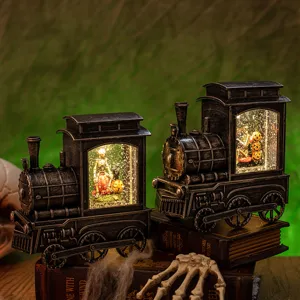Vintage Halloween locomotive snow globe lantern featuring skeleton and pumpkin scenes inside.