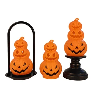Set of three stacked orange Halloween pumpkin lanterns with Jack-o'-lantern faces