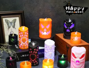 Detail view of assorted Halloween LED candles featuring pumpkin and skull designs