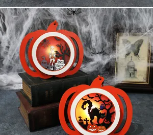 Detail view of Halloween LED pumpkin lights with cat and skeleton scenes