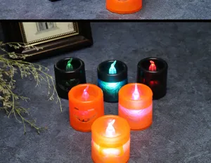 Decorative LED Halloween pumpkin candle lights with colorful glowing flames for party decor.