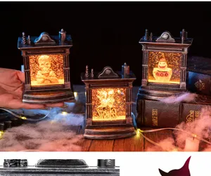 Set di lanterne da camino di Halloween luminose con statuine di fantasmi e teschi.