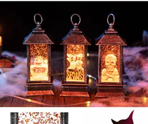 Detailansicht von drei Halloween-Laternen mit Kürbis-, Geist- und Totenkopf-Motiven