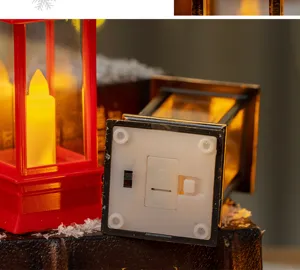 Detailed view of the LED candle lantern bottom with battery cover and CE mark.