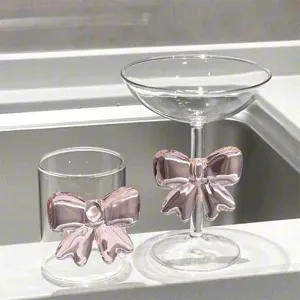 Detail view of pink bow glass cup high borosilicate glassware cute princess juice cup design