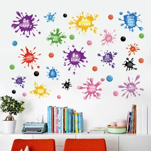 Colorful ink splash wall stickers with motivational quotes on a clean white wall