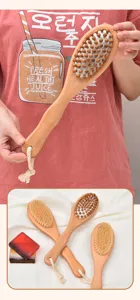 Wooden bath brush with natural bristles and massage nodes for body exfoliating spa.