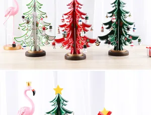 Macro view of tabletop colorful wooden mini Christmas trees with festive ornaments.