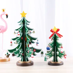 Set of two decorative wooden Christmas trees with mini ornaments for festive desktop display