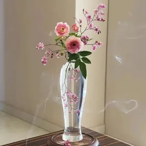Japanese transparent glass flower vase with wooden base for modern home decor. Zen style.