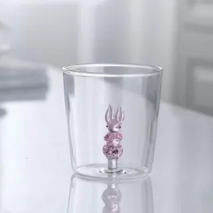Clear heat-resistant glass water cup with cute 3D pink bunny inside for daily milk breakfast.