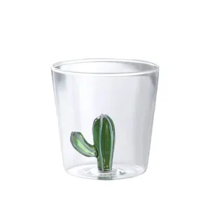 Clear glass water cup with cute 3D green cactus inside, perfect for daily milk and drinks.
