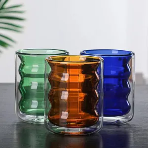 Colorful double wall glass cup with wavy caterpillar design, set of three transparent mugs.