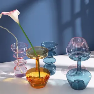 Detailed view of colorful glass bubble vases showcasing vibrant hues and unique artistic shapes.