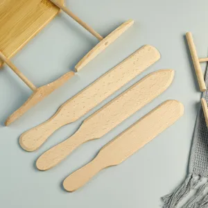 Wooden crepe spreader and batter rake set for making delicious homemade pancakes easily.