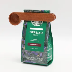 Wooden measuring spoon and bag sealing clip for coffee beans, kitchen baking tool, portable design.