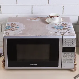 Floral microwave oven dust cover pastoral cloth protective cover with tassel decor detail.