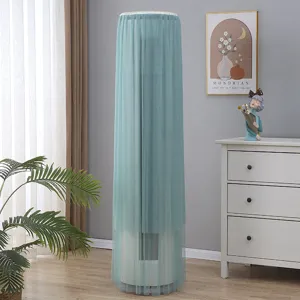 Detailed scene of standing round air conditioner dust cover in light green indoor mesh fabric.