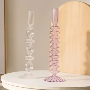 Detailed view of creative ribbed glass candle holder and vase, elegant transparent and purple design.