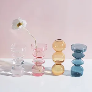 Detailed close-up view of artistic colored glass bubble vase showing stacking texture.