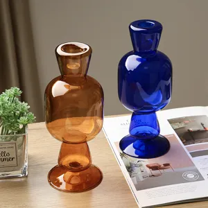 Creative minimalist glass candle holder and vase set for modern home table decor.