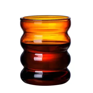 Amber wavy glass cup for coffee and milk, cute ripple caterpillar design for home use.