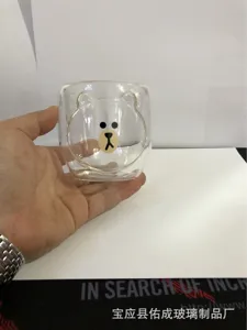Cute double wall glass cup with cartoon bear design, heat resistant transparent mug for coffee.