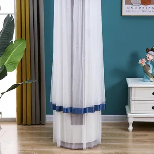 Detail view of the cylindrical vertical air conditioner dust cover in white lace with blue trim.