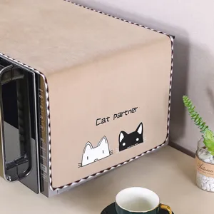 Copertura antipolvere beige per forno a microonde con simpatico motivo di gatto.