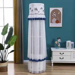 Cylindrical vertical air conditioner dust cover, elegant white lace embroidery with blue trim.