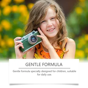 Child daily hair care product lifestyle scene showing gentle formula and happy kid outdoors.