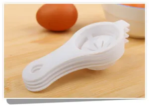 Detailed close-up view of a practical white plastic egg white and yolk separator tool.