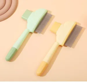 Close-up detail of pet grooming comb with fine metal pins and comfortable handle for daily use.