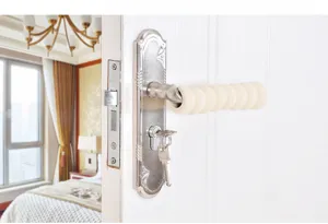 Silicone door handle protector spiral sponge safety cover detail view against home background