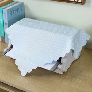 Detailed view of the blue polka dot printer dust cover with elegant scalloped lace edges.